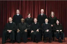  ?? ERIN SCHAFF — THE NEW YORK TIMES VIA AP, FILE ?? Members of the Supreme Court pose for a group photo at the Supreme Court in Washington. Seated from left are Associate Justice Samuel Alito, Associate Justice Clarence Thomas, Chief Justice John Roberts, Associate Justice Stephen Breyer and Associate Justice Sonia Sotomayor, Standing from left are Associate Justice Brett Kavanaugh, Associate Justice Elena Kagan, Associate Justice Neil Gorsuch and Associate Justice Amy Coney Barrett.
