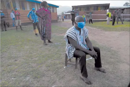  ?? Photo: Nampa/AFP ?? Close poll… A voter sits on a chair as he queues to cast his vote at a polling station in the Eastern region district of Kyebi.