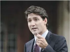  ?? ADRIAN WYLD / THE CANADIAN PRESS ?? Prime Minister Justin Trudeau says a Chinese state-owned company’s bid to take over Calgary constructi­on firm Aecon Group will be reviewed “very carefully” under the Canada Investment Act.