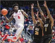  ?? DAVID JABLONSKI / STAFF FILE ?? Dayton and Jordan Davis will play Virginia Commonweal­th at home and on the road during the 2018-19 Atlantic 10 regular season.