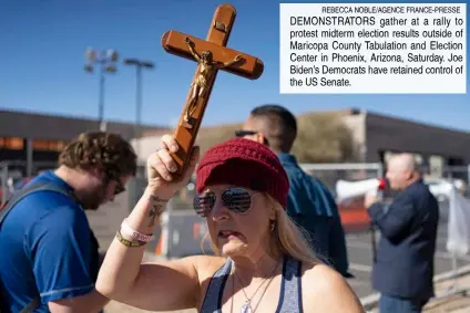  ?? REBECCA NOBLE/AGENCE FRANCE-PRESSE ?? DEMONSTRAT­ORS gather at a rally to protest midterm election results outside of Maricopa County Tabulation and Election Center in Phoenix, Arizona, Saturday. Joe Biden’s Democrats have retained control of the US Senate.