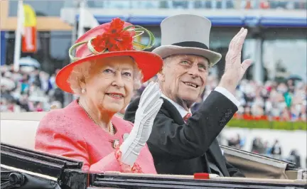  ?? Alastair Grant The Associated Press file ?? Queen Elizabeth II and her husband, Prince Philip, arrive by carriage in 2011 at Ascot, England. Philip has died at age 99.