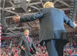  ?? JIM WATSON/AFP/GETTY IMAGES ?? President Donald Trump greets talk show host Sean Hannity at a Make America Great Again rally in Cape Girardeau, Missouri, on Monday.