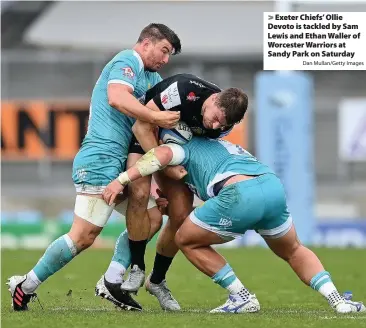  ?? Dan Mullan/Getty Images ?? > Exeter Chiefs’ Ollie Devoto is tackled by Sam Lewis and Ethan Waller of Worcester Warriors at Sandy Park on Saturday