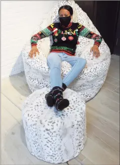  ?? Ned Gerard / Hearst Connecticu­t Media ?? Sales associate Annamour Joseph sits in one of the sacs available at the Lovesac showroom at 68 Post Road E. in Westport on Dec. 23.