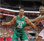  ?? COURTESY CLEVELAND STATE UNIVERSITY ?? Demonte Flannigan, a VASJ graduate, dunks during a British Basketball League game with the Cheshire Phoenix.
Cleveland State’s Demonte Flannigan, left, looks to post up against Louisville’s Akoy Agau on Nov. 26, 2014.