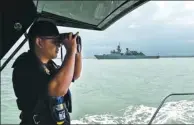  ?? MOHD RASFAN / AGENCE FRANCE-PRESSE ?? The Malaysian Navy takes part in the rescue operation for the missing sailors from the USS off the Johor coast of Malaysia on Thursday.