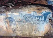  ??  ?? Horses depicted in a prehistori­c painting at Pech Merle cave, near Cabrerets, above