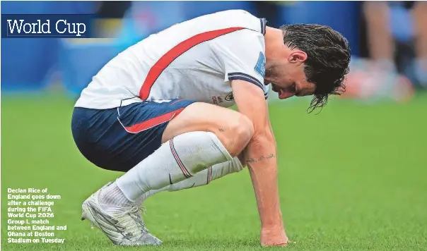  ?? ?? Declan Rice of England goes down after a challenge during the FIFA World Cup 2026 Group L match between England and Ghana at Boston Stadium on Tuesday
