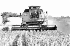  ??  ?? Soybeans are harvested on a farm on the outskirts of San Jose, Uruguay. American imports including soybeans, planes and cars in retaliatio­n for proposed US tariffs on US$50 billion in Chinese goods, has left Latin America in the middle, analyzing risks...