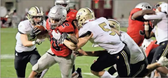  ?? Jeremy stewart, file ?? Cedartown’s Harlem Diamond (10) tries to break free of Calhoun’s Cole Speer (5) during a game last season. The Bulldogs will try to repeat as region champions this season under second-year head coach Jamie Abrams