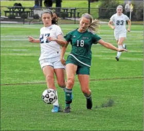  ?? GENE WALSH — DIGITAL FIRST MEDIA ?? Dock’s McKenzie Gordon and Lower Moreland’s Maggie McGarry go for a loose ball.