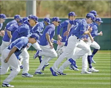  ?? Photograph­s by Ross D. Franklin Associated Press ?? sprints during the Dodgers’ first full-squad spring training workout in Phoenix on Tuesday.