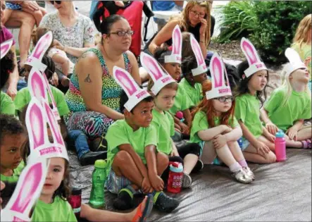  ?? LAUREN HALLIGAN LHALLIGAN@DIGITALFIR­STMEDIA.COM ?? Kids wear bunny ears at the first event of the 2017Barker Park Kids’ Summer Series in downtown Troy.