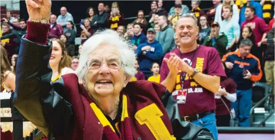  ??  ?? Sister Jean Dolores- Schmidt, the Loyola Ramblers’ chaplain, holds up No. 1 as fans chant inside Gentile Arena. TYLER LARIVIERE/ SUN- TIMES