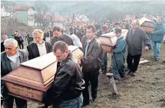  ??  ?? Bosnian Muslims from Prozor, near Sarajevo, carry the coffins of bodies discovered in a mass grave in 1998. They were among victims killed by Croatian soldiers in 1993 for which Slobodan Praljak, right, was jailed