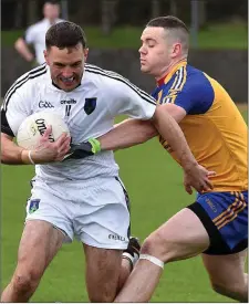  ??  ?? Andrew English halts Niall Donoher’s progress.