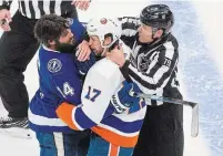  ?? JASON FRANSON THE CANADIAN PRESS FILE PHOTO ?? Tampa Bay Lightning’s Pat Maroon and New York Islanders’ Matt Martin (17) rough it up during second-period NHL Eastern Conference final playoff action in Edmonton on Sept. 9.