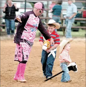  ?? MARK HUMPHREY ENTERPRISE-LEADER ?? Jerry Casey, also known as “The Sarge,” rodeo clown for the 64th annual Lincoln Rodeo directs traffic during the stick horse grand entry on May 17, 2017. Ethan Parker, 2017 Lincoln Riding Club Lil’ Mister, was about to have a runaway with his stick...