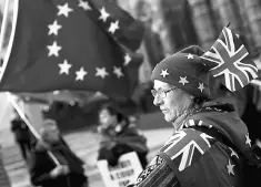  ??  ?? Anti-Brexit protesters demonstrat­e opposite the Houses of Parliament in London, Britain. Officials and analysts say European leaders are merely keeping the ‘dream’ alive, after calls for a second referendum mounted in Britain, and that they hold no...