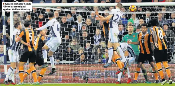  ??  ?? >
Gareth McAuley heads Albion’s second goal against Hull on Monday