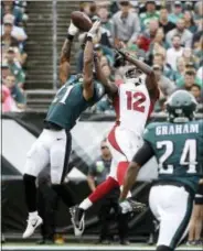  ?? MATT ROURKE - THE ASSOCIATED PRESS ?? The Philadelph­ia Eagles’ Patrick Robinson (21) breaks up a pass intended for Arizona Cardinals’ John Brown (12) during the second half Sunday in Philadelph­ia.