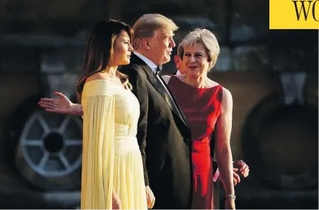  ?? BRENDAN SMIALOWSKI / AFP / GETTY IMAGES ?? British Prime Minister Theresa May, right, guides her guests Melania and Donald Trump before a black-tie dinner with business leaders at Blenheim Palace, west of London, on Thursday, the first day of the U.S. president’s four-day visit to the U.K. that will include tea with the Queen.