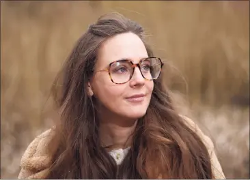  ?? Tyler Sizemore / Hearst Connecticu­t Media ?? Alyssa MacKenzie outside her apartment in New Canaan on Tuesday. MacKenzie has lupus, which made her hopeful for an early COVID-19 vaccine before Gov. Ned Lamont opted for age-based criteria rather than including underlying conditions.