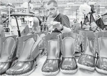  ?? Pat Wellenbach / Associated Press file ?? Eric Rego stitches L.L. Bean boots in Brunswick, Maine. Executive Chairman Shawn Gorman says L.L. Bean has more than 50 family members who are owners and that no one person speaks for the company.