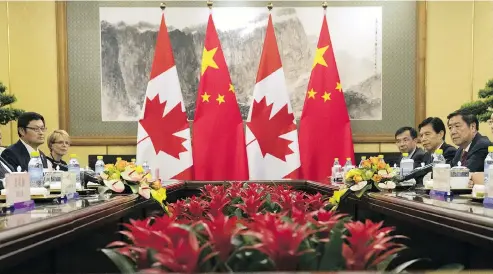  ?? MARK SCHIEFELBE­IN-POOL / GETTY IMAGES ?? A Chinese-Canadian businessma­n is fighting government allegation­s that he spied for China, in a case that illustrate­s the Chinese “vacuum cleaner” approach to intelligen­ce gathering.