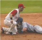  ?? STAFF FILE PHOTO BY ANGELA LEWIS FOSTER ?? Chattanoog­a Lookouts second baseman Levi Michael tags the Jackson Generals’ Brock Hebert during a game at AT&T Field last season. Michael, relief pitcher Nick Burdi and outfielder Travis Harrison begin their third season with the Lookouts tonight.