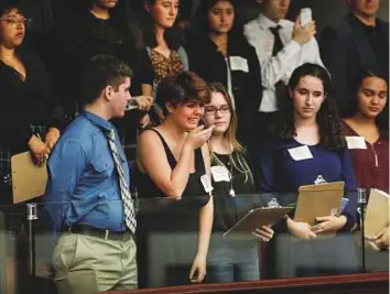  ?? Reuters ?? Students from Marjory Stoneman Douglas High School speak with Florida state legislator­s, following last week’s mass shooting on their campus, in Tallahasse­e on Tuesday.