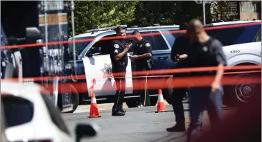  ?? DAI SUGANO — STAFF PHOTOGRAPH­ER ?? Officers on Bendorf Drive investigat­e on June 22after police shot a double homicide suspect in San Jose.