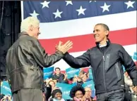  ??  ?? US President Barack Obama (R) is greeted by former president Bill Clinton during a campaign at Jiffy Lube Live in Bristow, Virginia