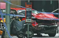  ?? EDGAR SU / REUTERS ?? The wreckage of a car is seen after it hit pedestrian­s in central Melbourne on Friday.