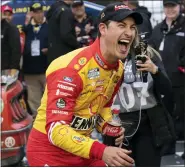  ?? MATT KELLEY — THE ASSOCIATED PRESS ?? Joey Logano reacts in Victory Lane after winning Sunday’s NASCAR Cup Series auto race at Darlington Raceway.