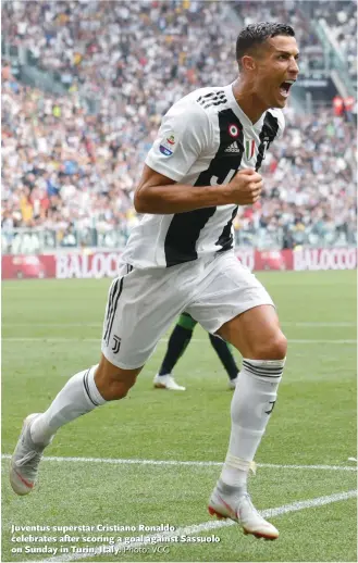  ?? Photo: VCG ?? Juventus superstar Cristiano Ronaldo celebrates after scoring a goal against Sassuolo on Sunday in Turin, Italy.