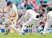  ?? — AFP ?? Alastair Cook plays a shot off Keshav Maharaj on the first day of the third Test on Thursday.