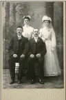  ?? ?? Joseph Thien, seated, left, was part of the wedding party for his sister’s wedding on May 18, 1904; his sister is Anna Catherine Thien, standing, right. Other members of the wedding party include Anna’s husband, Theodore Gebhart, seated, right, and maid of honor, Maria Neimann, standing, left.