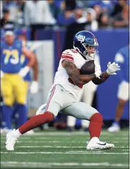  ?? Adam Hunger / Associated Press ?? Giants tight end Evan Engram runs against the Rams on Sunday in East Rutherford, N.J.