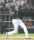  ?? JONATHAN DANIEL/ GETTY IMAGES ?? Sox shortstop Tim Anderson hits a runscoring double in the seventh inning Wednesday against the Cardinals.