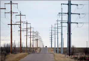  ?? NEWS PHOTO EMMA BENNETT ?? Powerlines line Range Road 63 south of the city limits. March 31 is the first day for utility companies to submit proposals for new facilities under the provincial Renewable Energy Program.