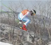  ?? Javier Soriano, Getty Images ?? Above: Wiley Maple catches big air Thursday while tuning up for the men’s downhill at the Winter Olympics in South Korea.