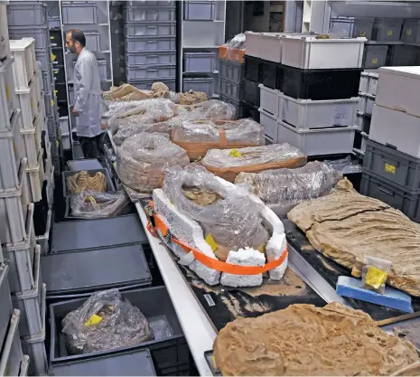  ?? (AFP) ?? This photo shows archaeolog­ical findings stored in a lab at the American School of Archeology, in Athens on July 7