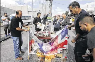  ?? NASSER SHIYOUKHI / ASSOCIATED PRESS ?? Palestinia­ns in Bethlehem stage a protest Wednesday around an effigy of Lord Arthur Balfour, whose promise to a British Zionist to establish a Jewish homeland in 1917 is being commemorat­ed in Britain and Israel and denounced in the occupied territorie­s.