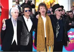  ?? FOTO-FOTO: JOEL RYAN/INVISION/AP ?? PENUH ENERGI: Personel The Rolling Stones, dari kiri, Charlie Watts, Ronnie Wood, Mick Jagger, dan Keith Richards di London Senin lalu (4/4).
Exhibition­ism