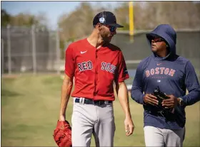 ?? BILLIE WEISS/ BOSTON RED SOX — GETTY IMAGES ?? Chris Sale, left, of the Boston Red Sox talks with former pitcher Pedro Martinez during a Boston Red Sox spring training workout on February 22, 2023 at jetblue Park at Fenway South in Fort Myers, Florida.