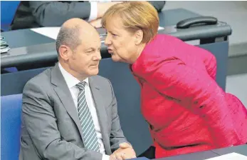  ?? FOTO: DPA ?? Auch Bundeskanz­lerin Angela Merkel ( CDU) hat Wünsche an Finanzmini­ster Olaf Scholz ( SPD): Am heutigen Mittwoch wird im Bundestag über den Kanzlereta­t beraten.