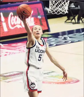  ?? David Butler II / USA Today ?? UConn’s Paige Bueckers (5) drives to the basket against Marquette on Monday night.