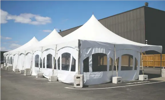  ?? DAX MELMER ?? A 3,000-square-foot tent to increase work space for social distancing has been put up in the parking lot outside Cavalier Tool & Manufactur­ing Ltd. in Windsor this week.